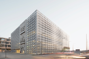  Die variierend tiefe Kantung der Fassadenmodule ergibt ein Wellenbild über die beiden langen Fassadenseiten zu den angrenzenden Straßen hin 
