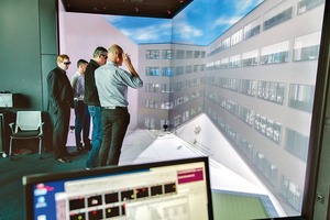  Besonders spannend waren zwei außergewöhnliche Besprechungstermine im „Immersive En­gineering Lab“ am Fraunhofer IAO in Stuttgart. Dabei handelt es sich um ein mehrseitiges, großflächiges Stereoprojektionssystem zur interaktiven, räumlich-maßstäblichen Visualisierung von Gebäuden 